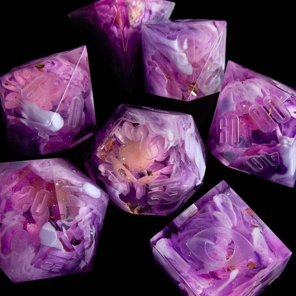Purple and white swirled resin dice on black