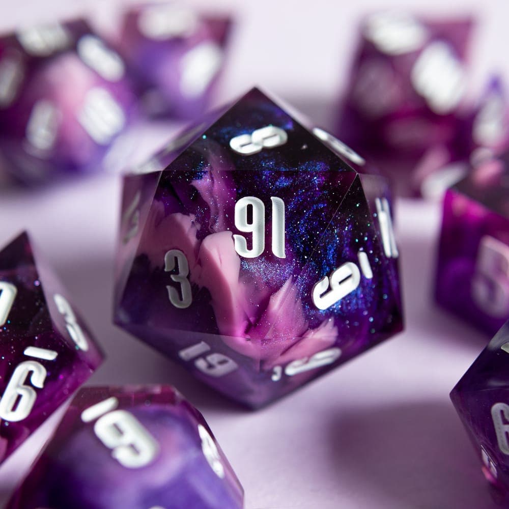 The Cosmic Bloom chonk: a purple galaxy D20 with white numbers